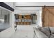 Entertainment area with a custom bar, wood accent wall, and a sliding barn door at 7841 Georgeann St, Winter Park, FL 32792