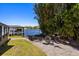 Boat trailer parked next to canal with boat lift and covered boat house at 7841 Georgeann St, Winter Park, FL 32792