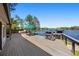 Outdoor deck offers lake views, lounge chairs, grill, and access to hot tub at 7841 Georgeann St, Winter Park, FL 32792