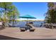 Lounge chairs and outdoor umbrella on deck with lake and dock views at 7841 Georgeann St, Winter Park, FL 32792