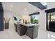 Dining area featuring a large table and decor complemented by modern lighting fixtures and bright natural light at 7841 Georgeann St, Winter Park, FL 32792