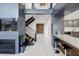 Modern hallway with tiled floors and stylish architectural accents at 7841 Georgeann St, Winter Park, FL 32792