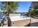 Back deck features hot tub with view of boat docks on clear lake at 7841 Georgeann St, Winter Park, FL 32792