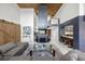 Bright open-plan living room with a gray sofa, high ceilings, and modern finishes at 7841 Georgeann St, Winter Park, FL 32792