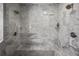 Luxurious walk-in shower featuring marble tiling and dual shower heads at 7841 Georgeann St, Winter Park, FL 32792