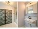 Modern bathroom with a frameless glass shower and floating sink at 809 Poinsettia Dr, Eustis, FL 32726