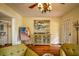 Living room featuring unique art, a vintage hutch, and hardwood floors, creating a cozy atmosphere at 809 Poinsettia Dr, Eustis, FL 32726