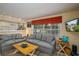 Comfortable living room featuring a contemporary design, natural light, and open connection to the kitchen at 809 Poinsettia Dr, Eustis, FL 32726