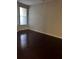 This bedroom is empty, has hardwood floors, and a gray paint color at 860 N Orange Ave # 149, Orlando, FL 32801