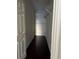 This walk in closet has hardwood floors, a built-in metal shelf, and a door at 860 N Orange Ave # 149, Orlando, FL 32801