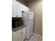 Efficient kitchen featuring white appliances, granite countertops, and ample cabinet space for a functional cooking experience at 860 N Orange Ave # 149, Orlando, FL 32801