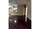 Open-concept living area with hardwood floors, white trim, and seamless transition to the kitchen and dining spaces at 860 N Orange Ave # 149, Orlando, FL 32801