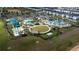 Aerial view of the community featuring a large pool, waterslide, miniature golf and ample parking at 9123 Sommerset Hills Dr, Davenport, FL 33896