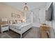 Serene main bedroom with a white bed, neutral decor, and plenty of natural light at 9123 Sommerset Hills Dr, Davenport, FL 33896