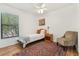 Cozy bedroom with wood floors, a ceiling fan, and plenty of natural light at 1120 Parker Canal Ct, Oviedo, FL 32765