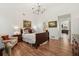 The primary bedroom features hardwood floors, chandelier, and an ensuite at 1120 Parker Canal Ct, Oviedo, FL 32765