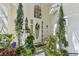 Welcoming front entrance with decorative plants and a stylish front door at 1120 Parker Canal Ct, Oviedo, FL 32765