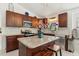 Bright and airy kitchen features granite counters, stainless appliances, and a center island at 1120 Parker Canal Ct, Oviedo, FL 32765