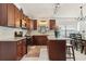 Gourmet kitchen with granite counters, stainless appliances, and a decorative backsplash at 1120 Parker Canal Ct, Oviedo, FL 32765