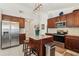 Well-equipped kitchen with center island, stainless appliances, and ample cabinet space at 1120 Parker Canal Ct, Oviedo, FL 32765