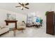 Spacious living room with tile floors, fireplace, and a view of the backyard at 1120 Parker Canal Ct, Oviedo, FL 32765