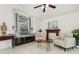 Inviting living room with tile flooring, bright window and cozy seating area at 1120 Parker Canal Ct, Oviedo, FL 32765