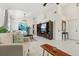 Spacious living room featuring tile floors, entertainment center and neutral colored walls at 1120 Parker Canal Ct, Oviedo, FL 32765