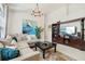 Comfortable living room with a cozy sectional sofa, modern decor and tiled flooring at 1120 Parker Canal Ct, Oviedo, FL 32765