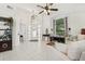 Open living room with high ceilings, arched window, and lots of natural light at 1120 Parker Canal Ct, Oviedo, FL 32765