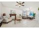 Bright living room with tiled floors, ceiling fan, fireplace and comfortable seating at 1120 Parker Canal Ct, Oviedo, FL 32765