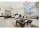 Large living room offers ample seating, natural light, and modern décor at 1120 Parker Canal Ct, Oviedo, FL 32765