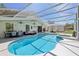 Screened-in pool and spa area with outdoor furniture and ceiling fans for relaxing in the shade at 1120 Parker Canal Ct, Oviedo, FL 32765