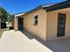 Back corner of the home with a covered patio at 124 Harrison Rd, Daytona Beach, FL 32118