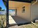 Large covered patio with an easy view of the backyard at 124 Harrison Rd, Daytona Beach, FL 32118
