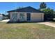 Charming single-story home with a well-maintained lawn and inviting curb appeal at 124 Harrison Rd, Daytona Beach, FL 32118