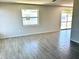 Bright living room with tile floors and a neutral color palette at 124 Harrison Rd, Daytona Beach, FL 32118