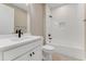 Bathroom showing vanity, toilet, and shower-tub combination with tiled walls at 1276 Jackson Hole Ct, Deland, FL 32724
