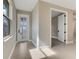 Bright entryway featuring a glass-panel front door and neutral-colored walls at 1276 Jackson Hole Ct, Deland, FL 32724