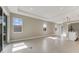 Sun-drenched living room showcasing recessed lighting and a seamless flow to the kitchen area at 1276 Jackson Hole Ct, Deland, FL 32724