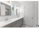Bathroom featuring double sinks, modern hardware, and tile floors at 13087 Salk Way, Orlando, FL 32827