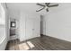 Bedroom featuring a closet, ceiling fan, and wood-look flooring at 13087 Salk Way, Orlando, FL 32827