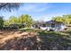 Spacious backyard with mature trees, offering privacy and room for outdoor activities at 1338 Franklin St, Altamonte Springs, FL 32701