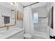 Charming bathroom showcasing tile flooring, a shower-tub combination, and a vanity with a sink at 1338 Franklin St, Altamonte Springs, FL 32701