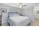 Bright bedroom with hardwood floors, a cozy bed, closet space, and access to an ensuite bathroom at 1338 Franklin St, Altamonte Springs, FL 32701