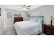 Sunlit bedroom boasts wood-look flooring, a comfortable bed, and a large window at 1338 Franklin St, Altamonte Springs, FL 32701