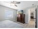 Well-lit bedroom features hardwood floors, a dresser, and a neutral color palette at 1338 Franklin St, Altamonte Springs, FL 32701