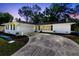 Charming white home with a well-manicured lawn and a spacious driveway at 1338 Franklin St, Altamonte Springs, FL 32701