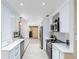Bright and modern kitchen with stainless steel appliances and white cabinets at 1338 Franklin St, Altamonte Springs, FL 32701
