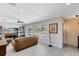 Cozy living room showcasing wood-look flooring, recessed lighting, large window, ceiling fan, and neutral paint at 1338 Franklin St, Altamonte Springs, FL 32701