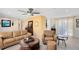 Comfortable living room featuring a ceiling fan, hardwood floors, modern furniture, and neutral paint at 1338 Franklin St, Altamonte Springs, FL 32701